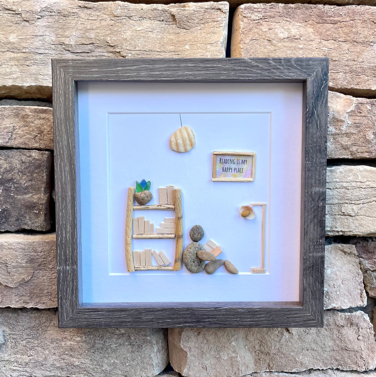 Unique Gift for Book Lovers, 8x8 Pebble Art Picture of Reader Surrounded by Books, Wall Sign Says &quot;Reading is My Happy Place&quot;